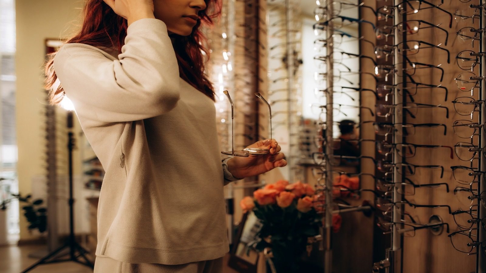 Luxury eyewear boutique scene with frames and warm lighting
